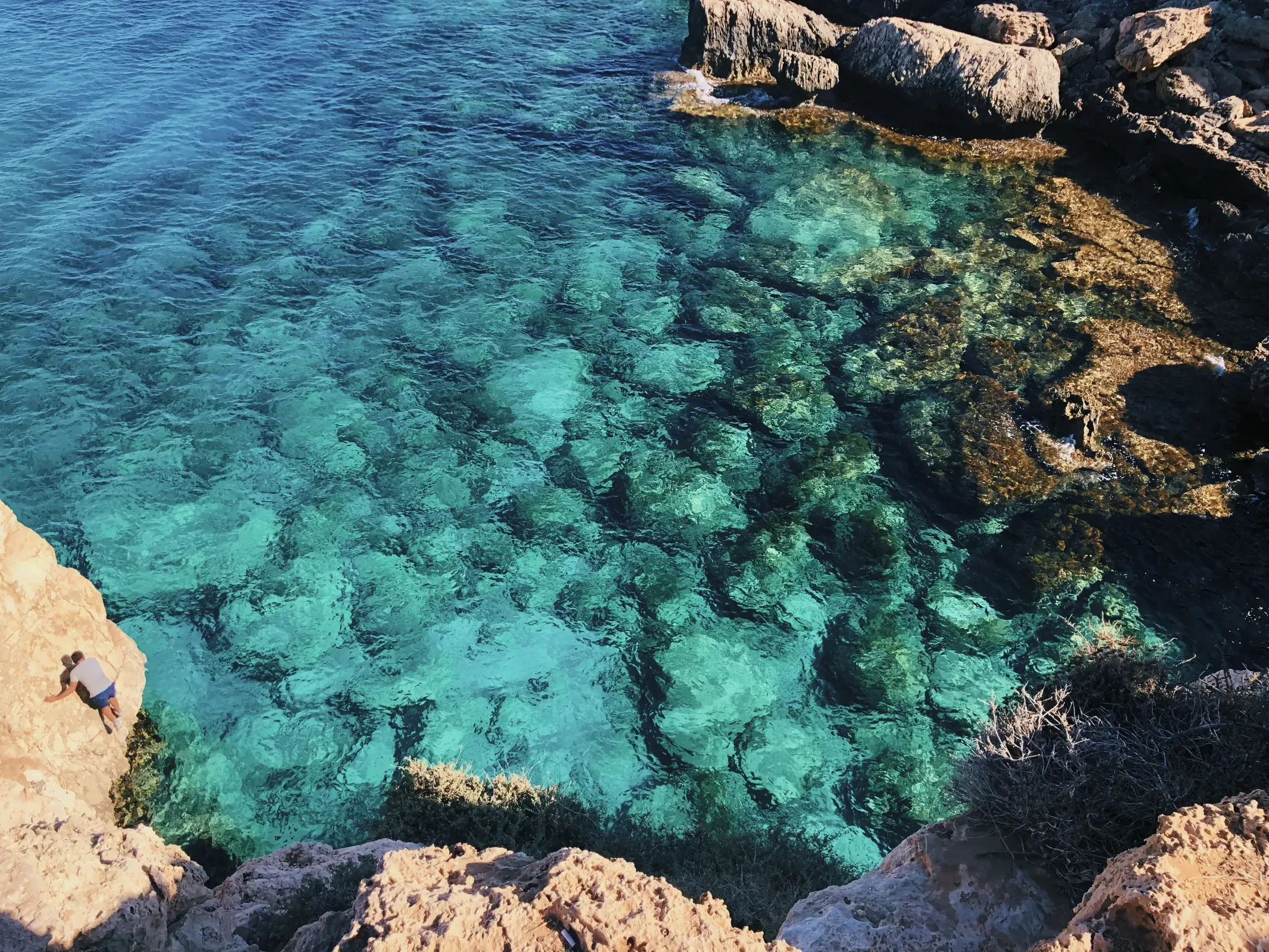 Captivating view of Cape Greco National Park showcasing a rugged coastline and serene blue water.