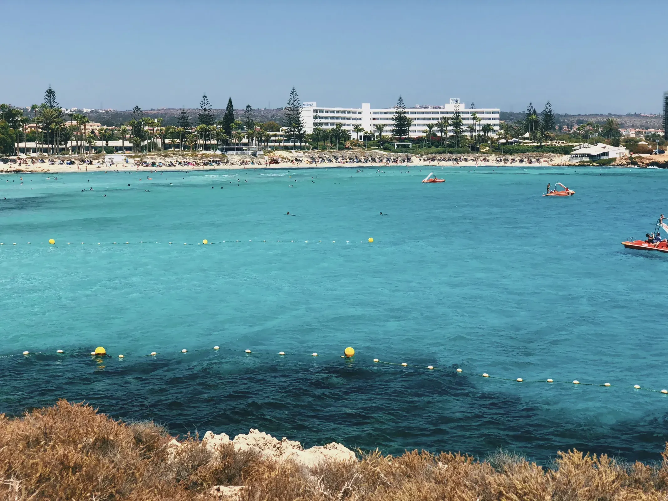 People enjoying Nissi Beach in Ayia Napa, Cyprus