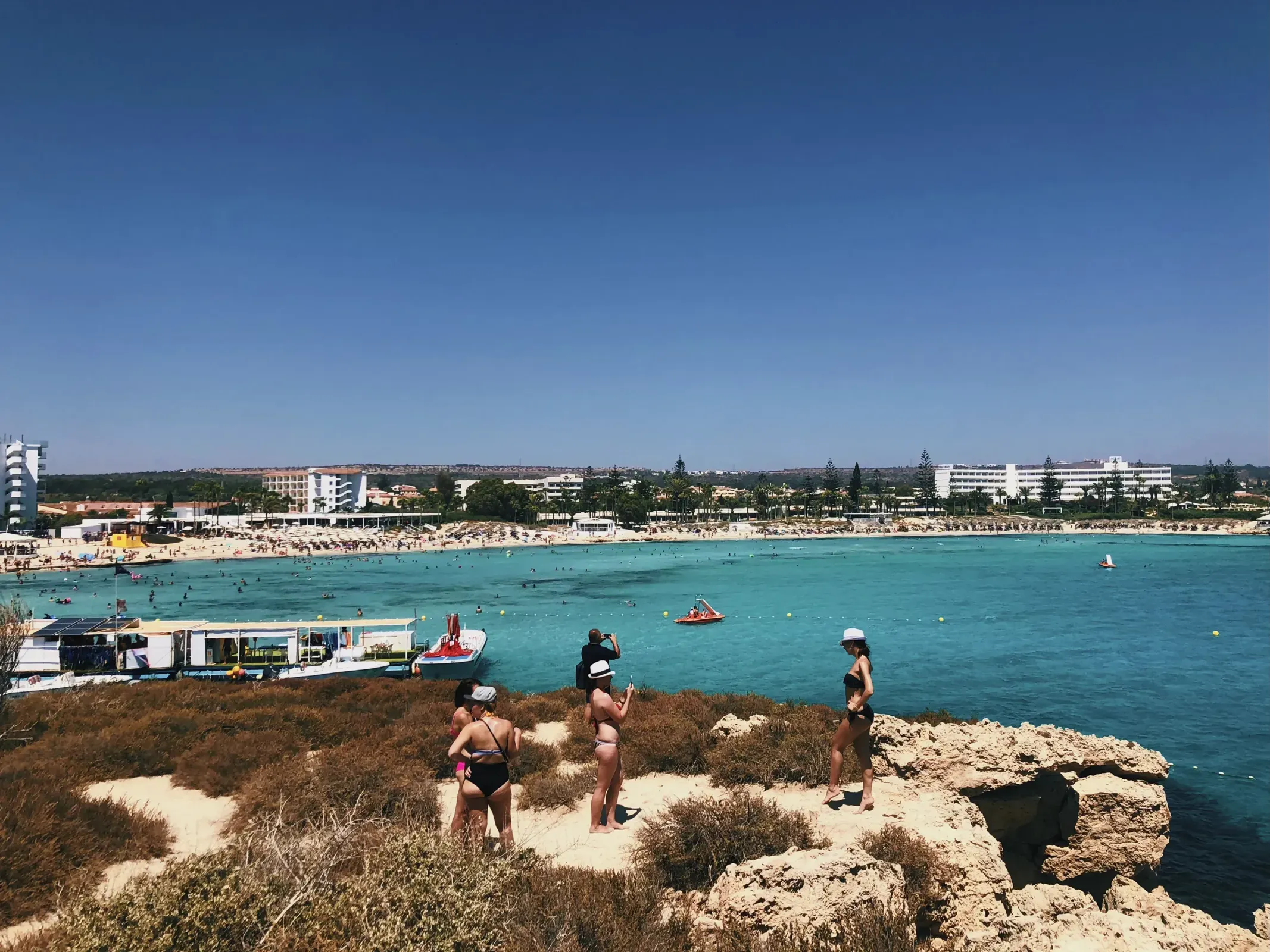 Group of people on Nissi Beach in Ayia Napa, Cyprus.