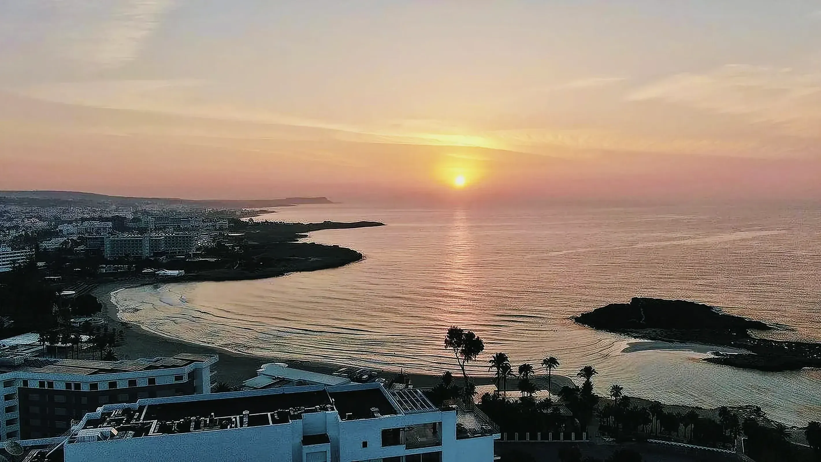 Breathtaking sunset over Nissi Beach in Ayia Napa, Cyprus.