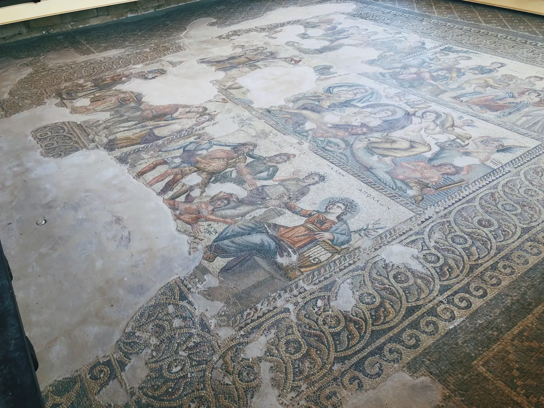 Intricate mosaic floor depicting figures, both humans and animals.