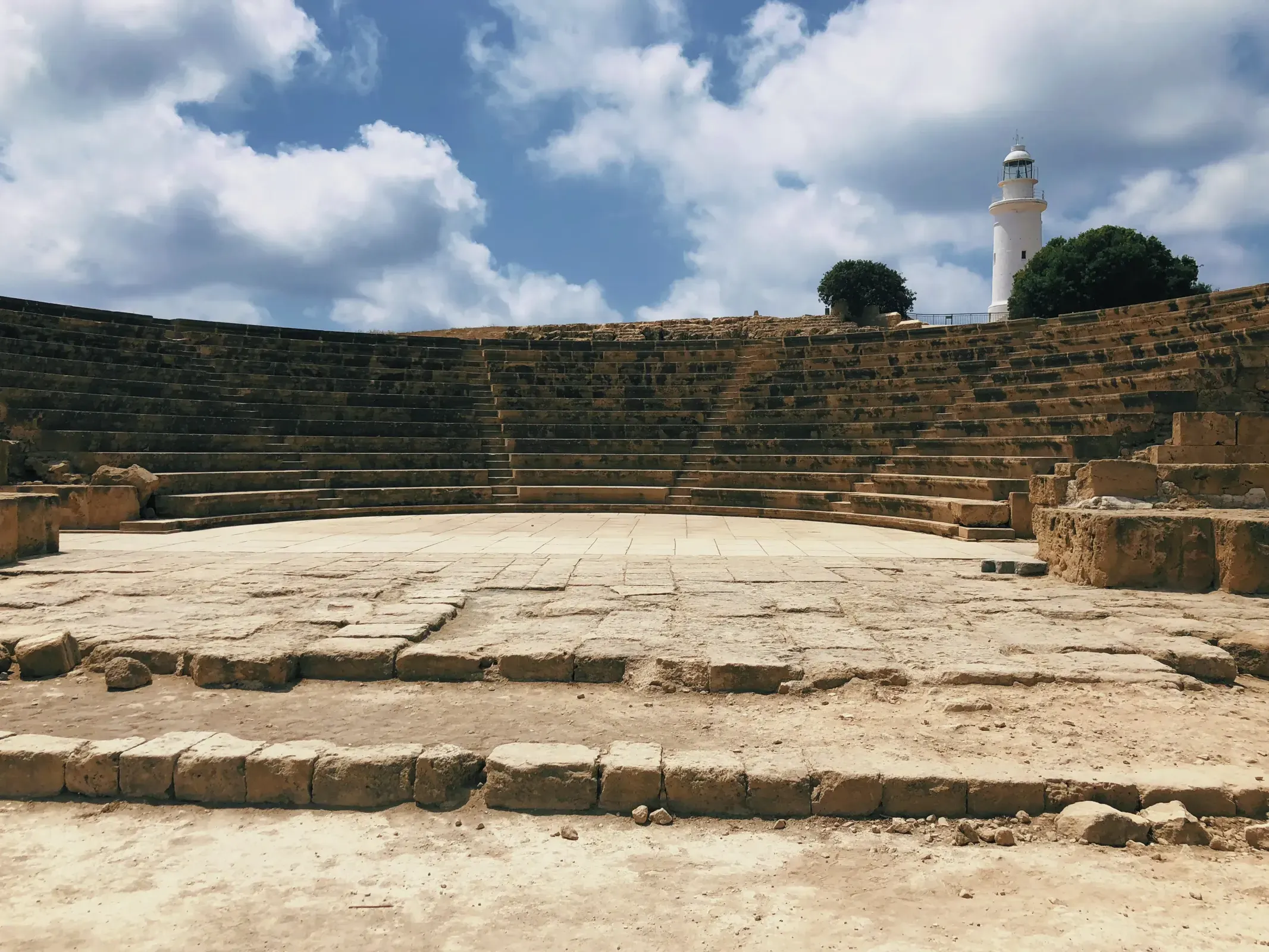 Vast stone arena with scattered rocks in Nea Paphos