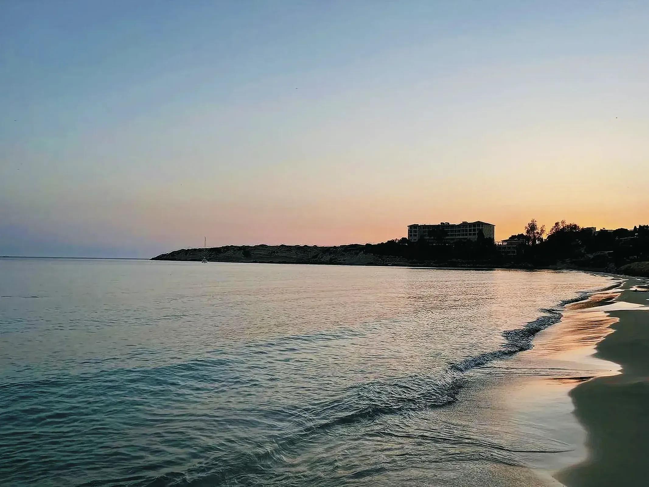 Serene sunset at Coral Bay beach in Cyprus