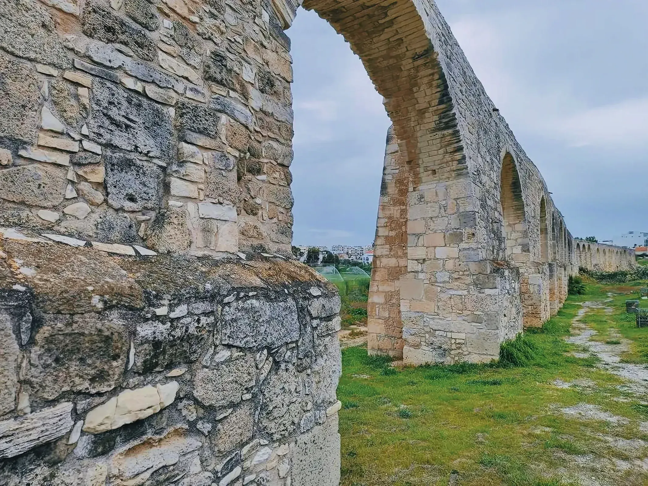 Stone archways of the Kamares Aqueduct in Larnaca, Cyprus.